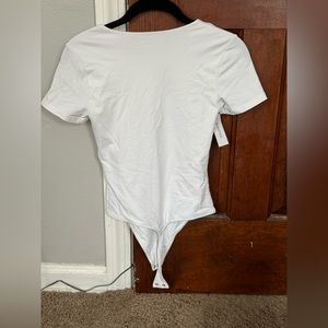 White artino’s babton body suit, size small, never worn
